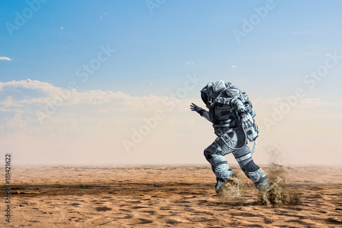 Wallpaper Mural Spaceman running fast. Mixed media Torontodigital.ca