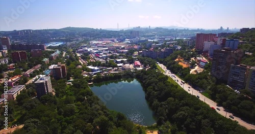 Aerial descending view of the Mine Park (Minny Gorodok) lake. It's a former military base that was founded in 1880 and converted into a park in 1985. Vladivostok, Russia photo