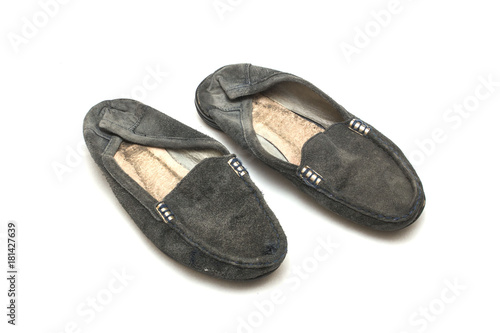 worn out female shoes on white isolated background