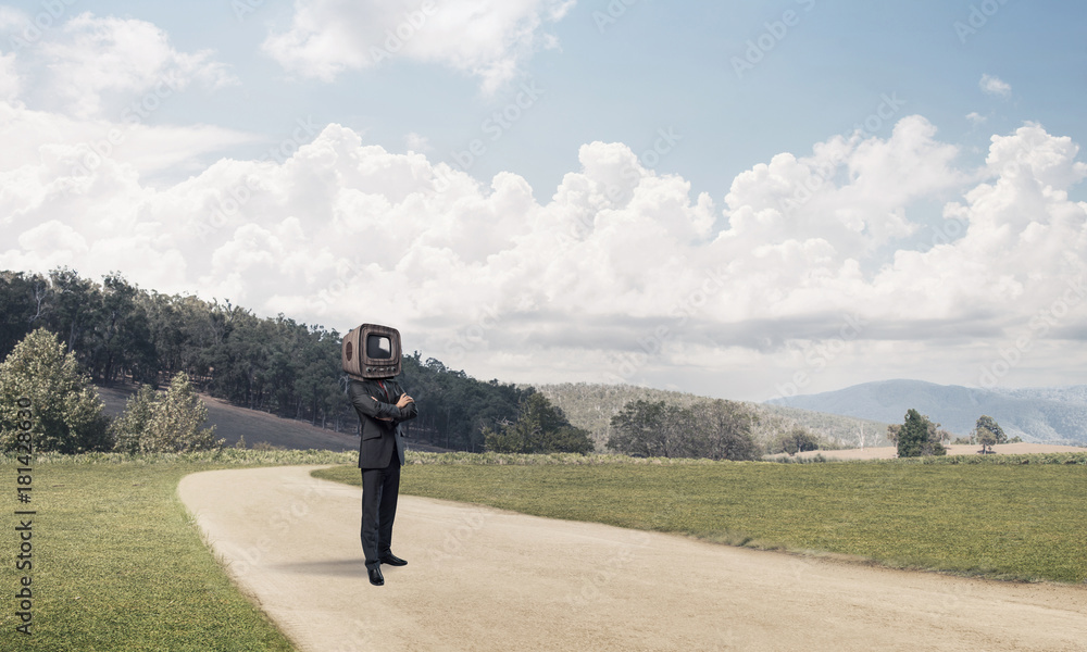 Businessman with old TV instead of head.