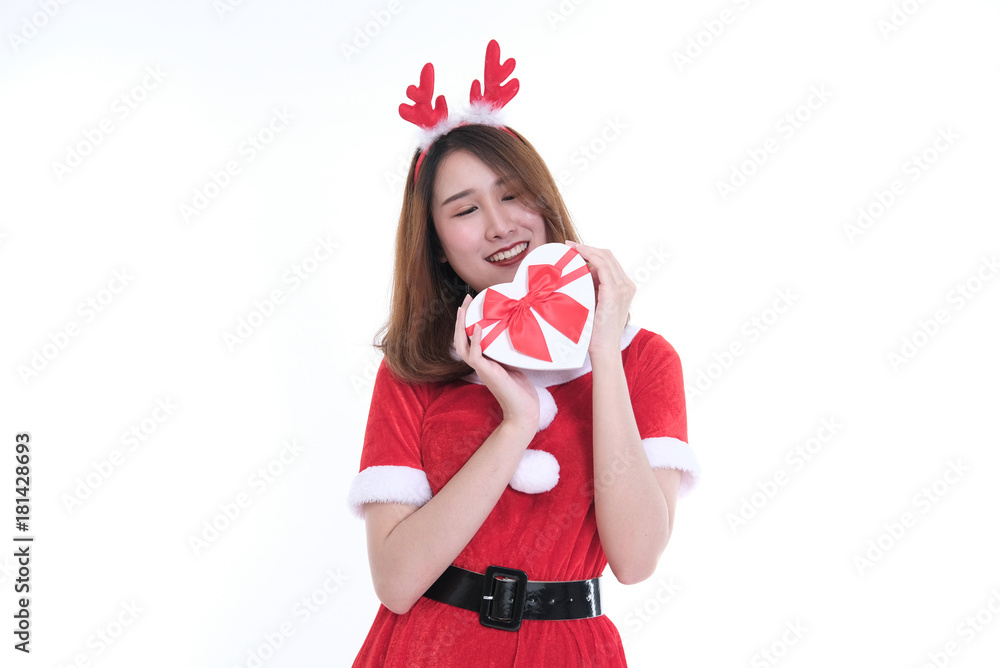 Fototapeta premium portrait of asian woman in santa claus dress on white background. girl with gift present box. christmas holiday. merry xmas celebration.