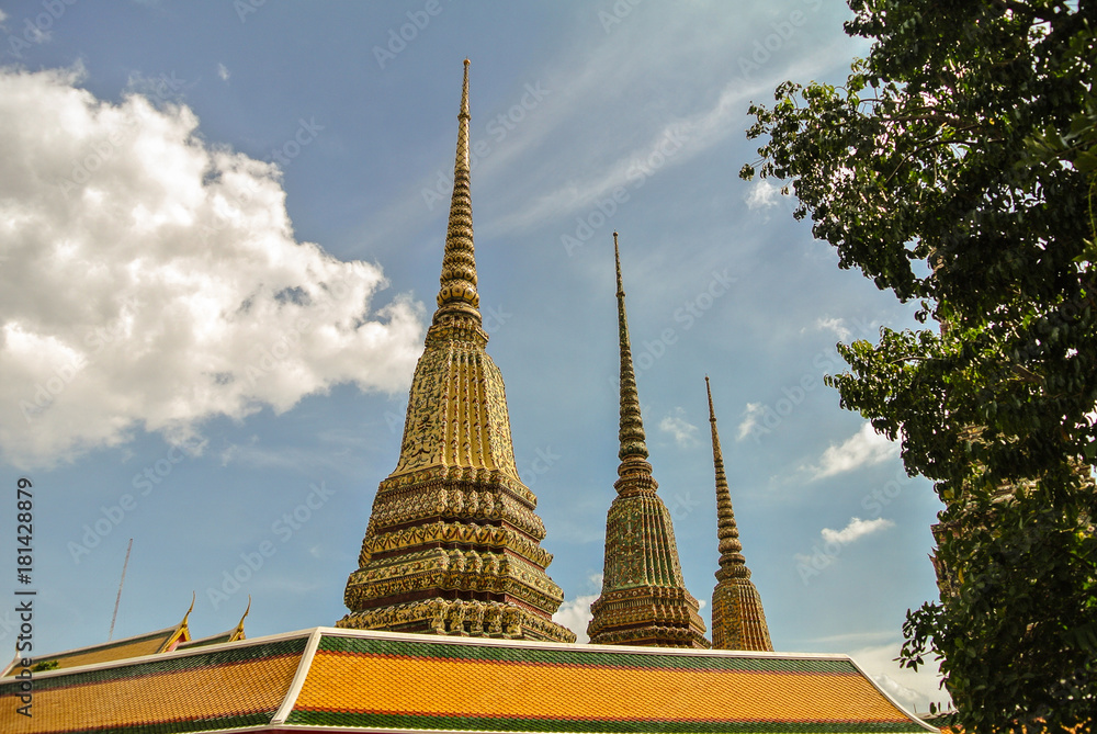 Fototapeta premium Pagoda is in Wat Pho that was named as the temple of the pagoda or chedi that are decorated with yellow glaze or glazed tiles or dark blue. 