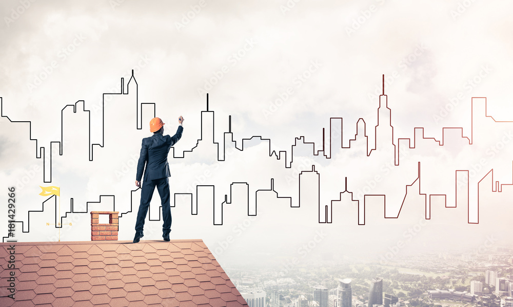 Man architect draw silhouette of modern city on blue sky. Mixed Man architect draw silhouette of modern city on blue sky. Mixed