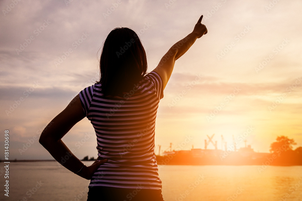 happiness and jouful woman girl rise hand up into sky background