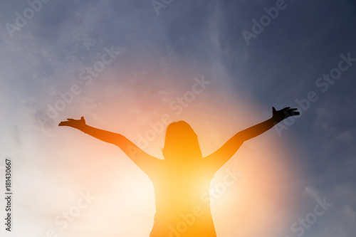 Tableau sur toile happiness and jouful woman girl rise hand up into sky background