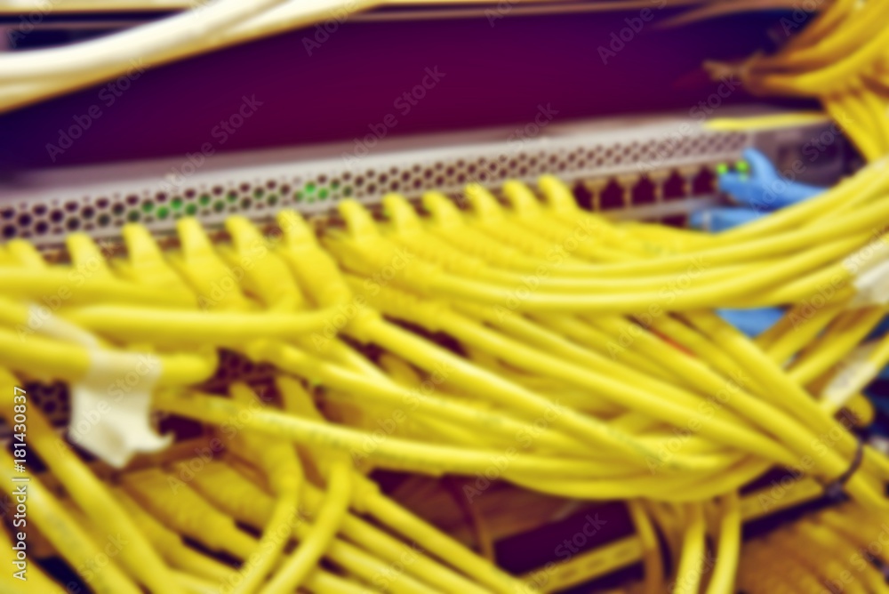blurred image of severs computer in a rack at the large data center. blurred image of severs computer in a rack at the large data center.