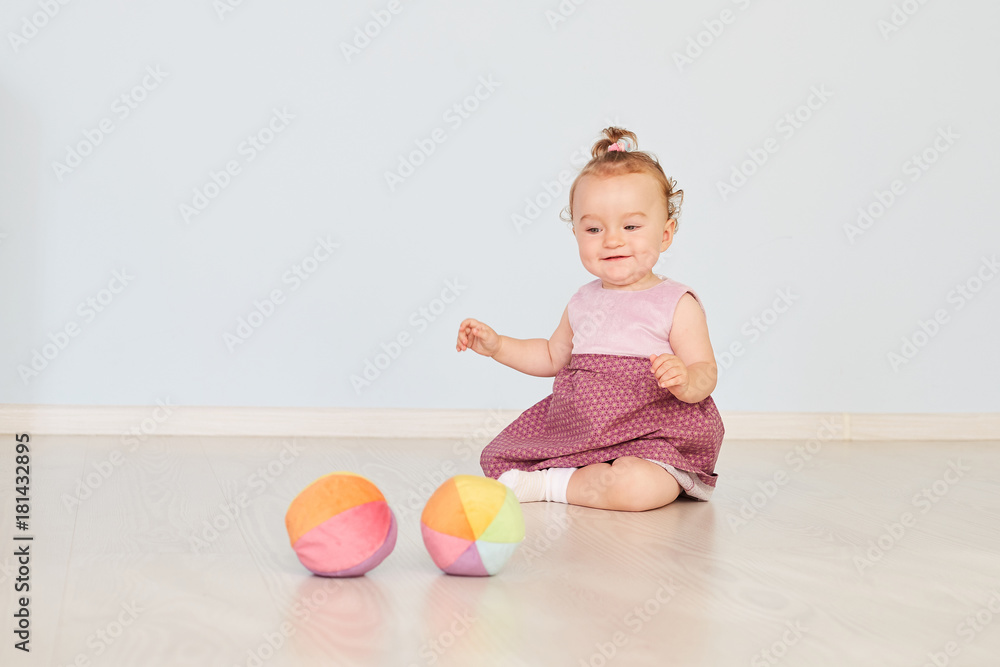 little child is playing with toys in the studio little child is playing with toys in the studio
