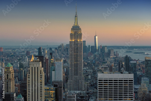 New York City skyline with urban skyscrapers at sunset, NY, USA. © lucky-photo