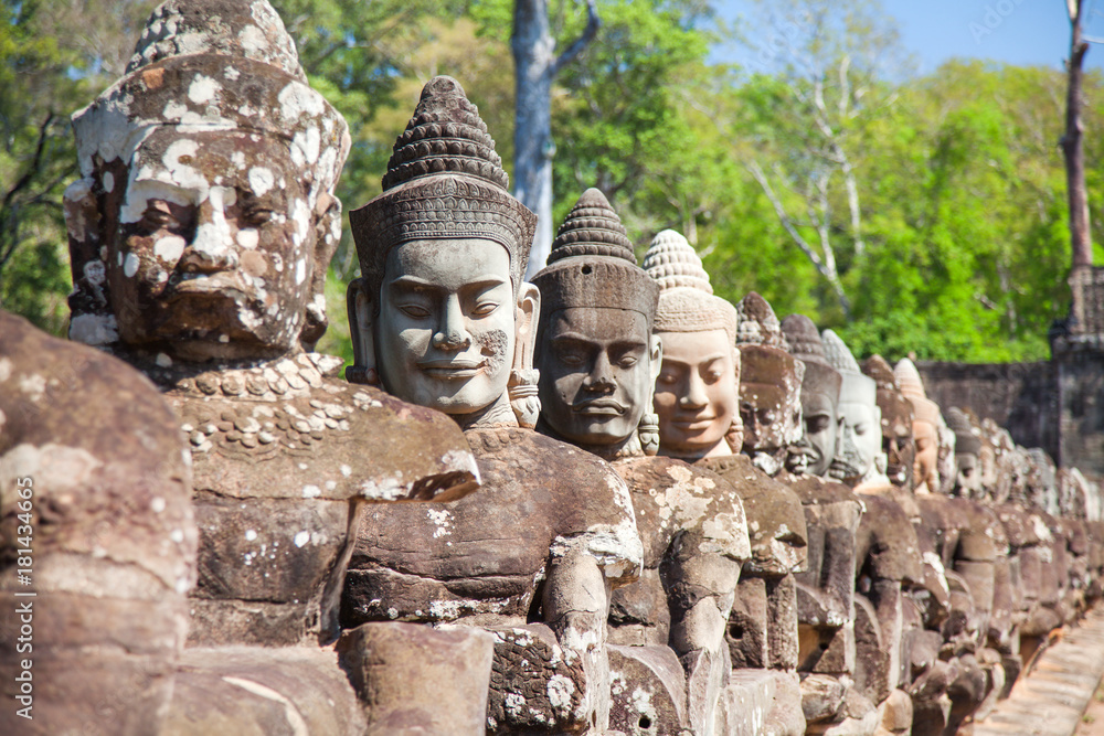 Naklejka premium Stone heads guards South Gates of Angkor Thom, Siem Reap, Cambodia