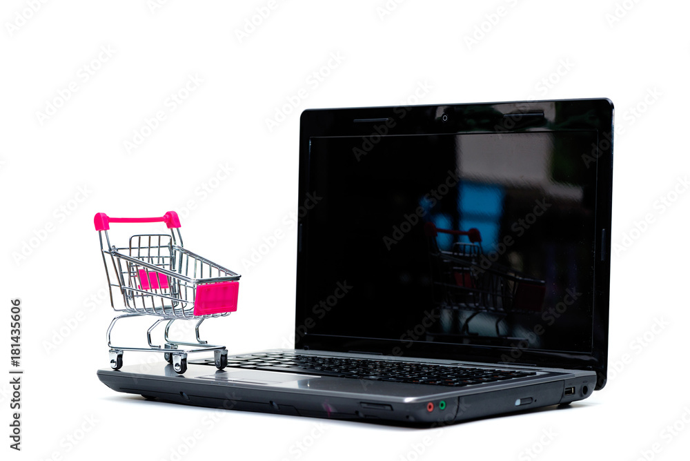 Shopping cart or supermarket trolley with laptop notebook isolated on white background, e-commerce and online shopping concept.