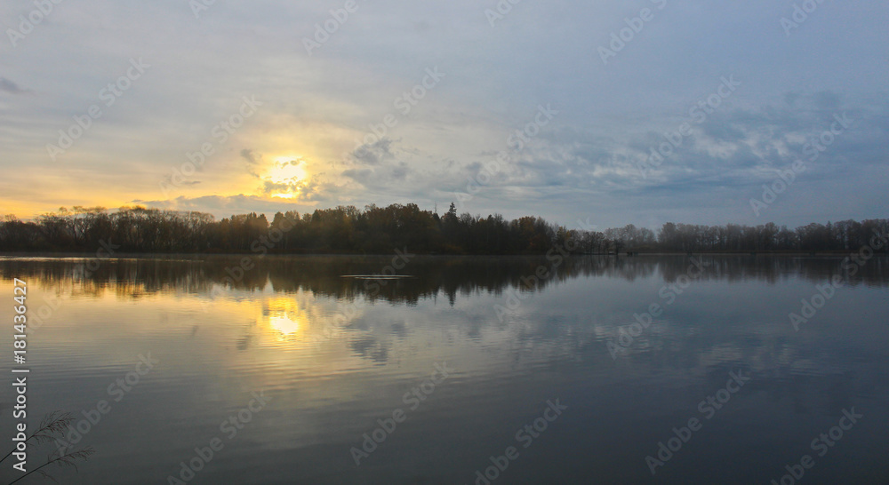 Sunrise on blue sky and pond, Czech landscape