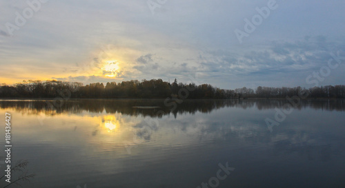 Sunrise on blue sky and pond, Czech landscape