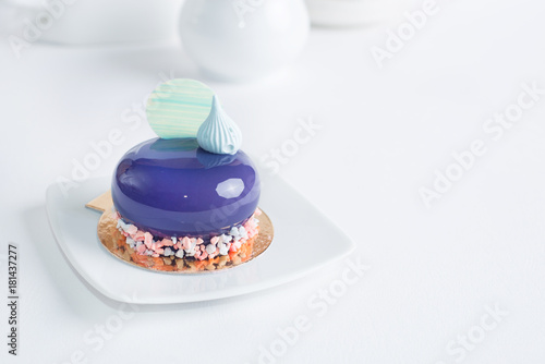 Fotografi French mousse cake covered with violet glaze