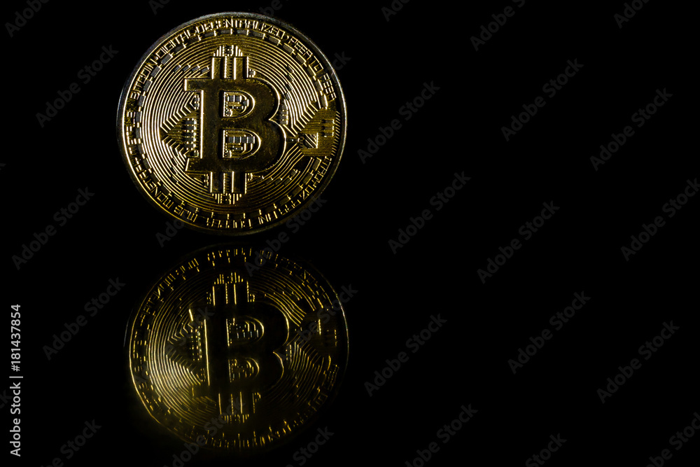 Golden bitcoin on black background with copy space cryptocurrency mining concept