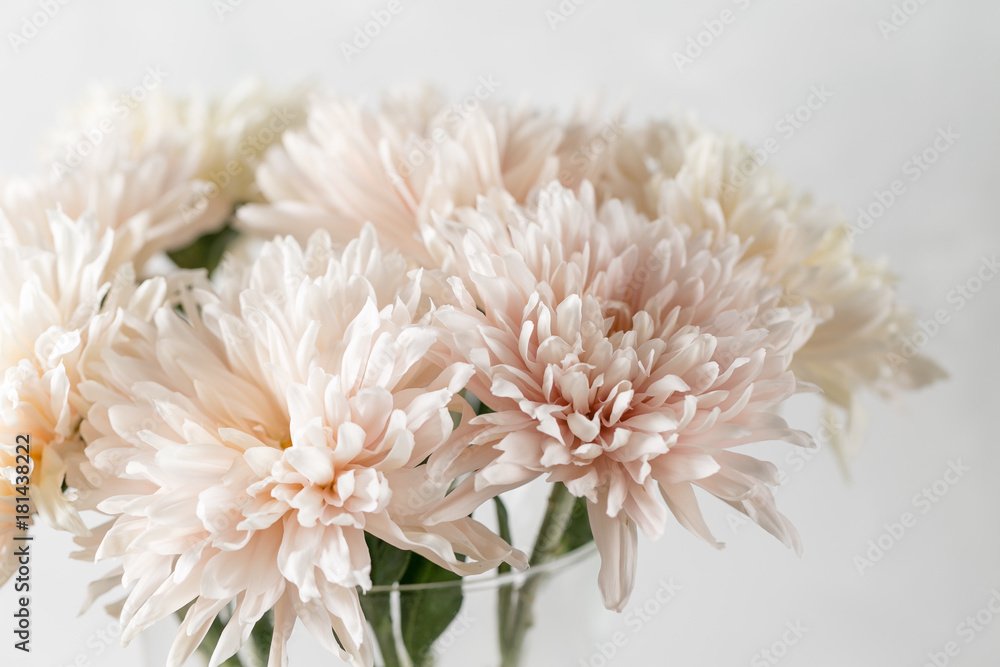 Vase with white chrysanthemum on a table of wooden planks Vase with white chrysanthemum on a table of wooden planks
