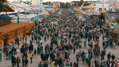 September 17, 2017 - Oktoberfest, Munich, Germany:View of the huge crowd of people walking around the Oktoberfest in national bavarian suits, on Theresienwiese, top view photo