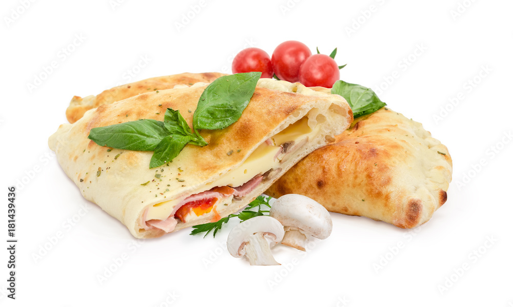 Whole and half of baked calzone, mushrooms, cherry tomatoes