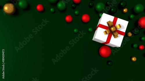 3d white gift box tied with a red satin ribbon bow. and COLOR balls on green background.for Christmas and new year.