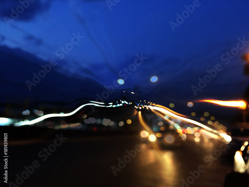 night traffic bokeh.Out of focus city blur background.Moving bokeh circles on night traffic.