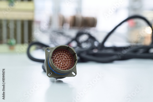 Wall Mural Circular multi-pin connector lie on the table.