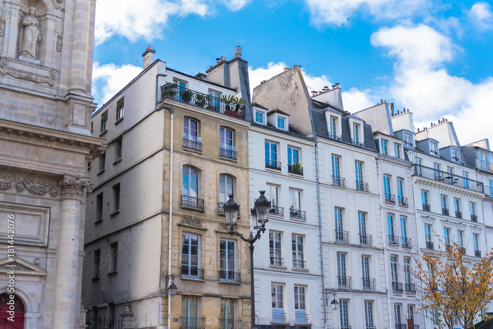 Paris, typical facades in the Marais, beautiful buildings 
