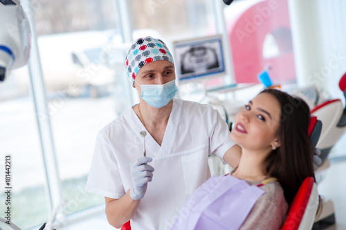 Portrait of a dentist and a beautiful girl in dentistry.