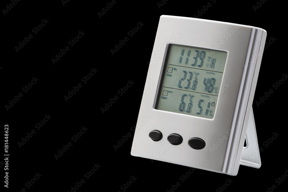 Weather station device with weather conditions inside and outside isolated on the black background. Selective focus Weather station device with weather conditions inside and outside isolated on the black background. Selective focus