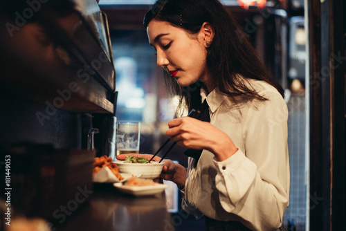 Japanese woman eating in a restaurant