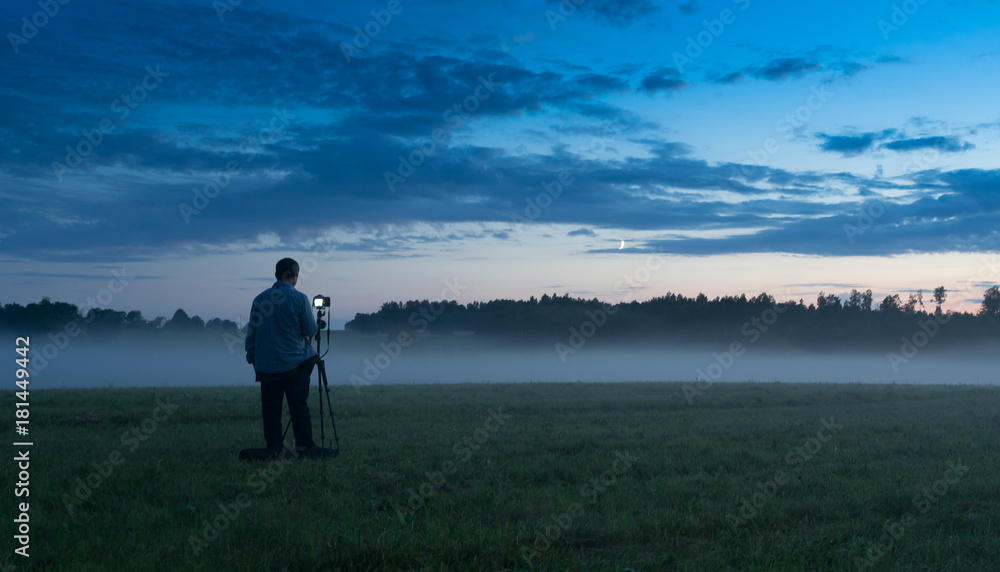 Photographer in a fog field Photographer in a fog field