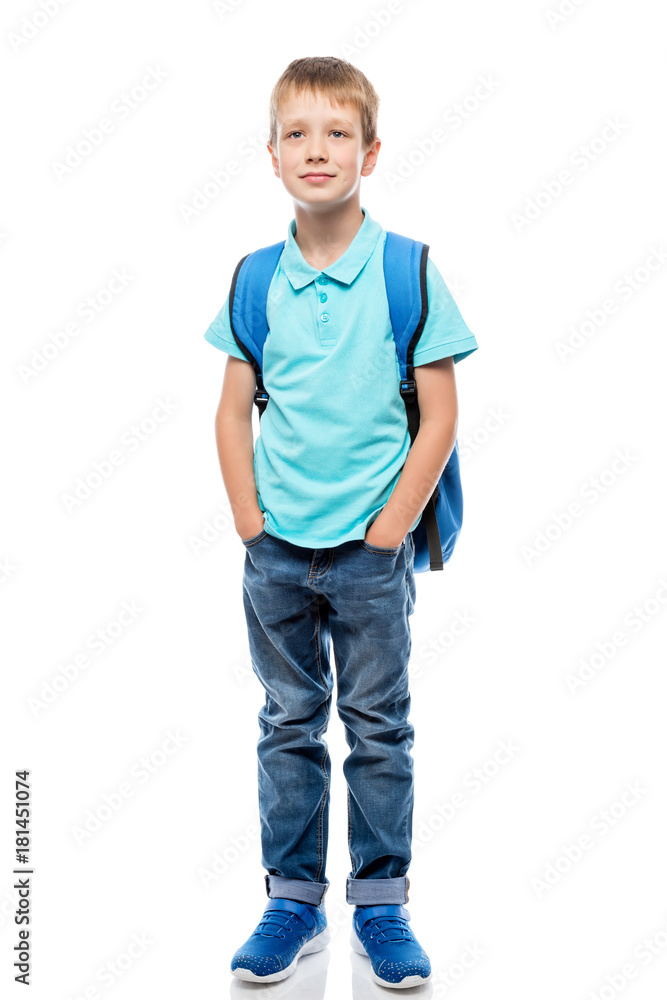 Fototapeta premium portrait of a schoolboy in full length on a white background in studio