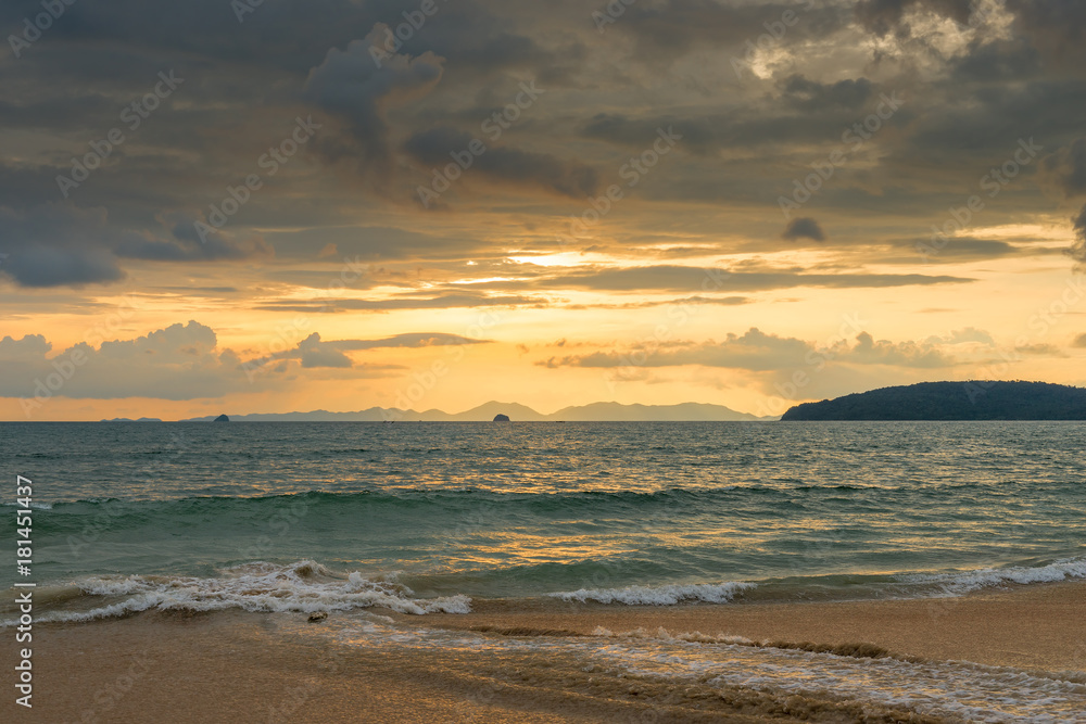 orange sunset in Thailand in golden tones, beautiful clouds over the sea orange sunset in Thailand in golden tones, beautiful clouds over the sea