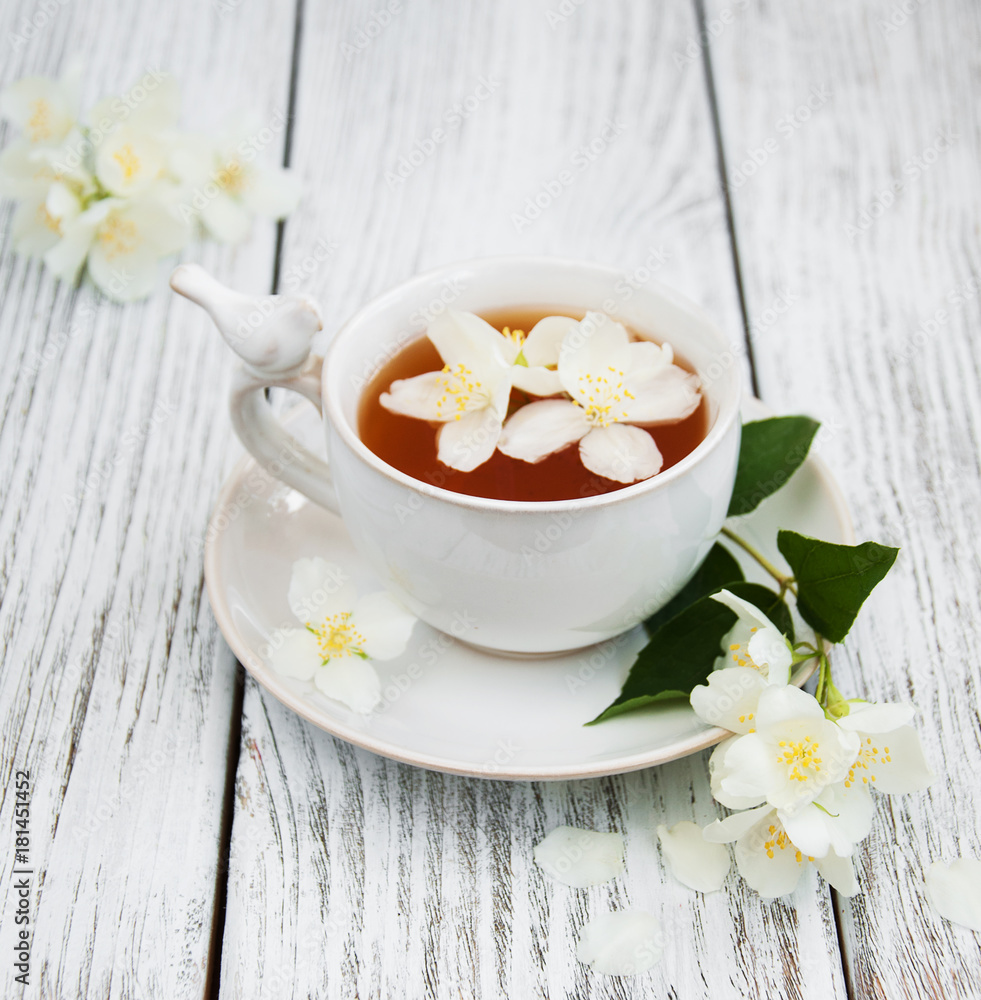 Cup of tea with jasmine flowers Cup of tea with jasmine flowers