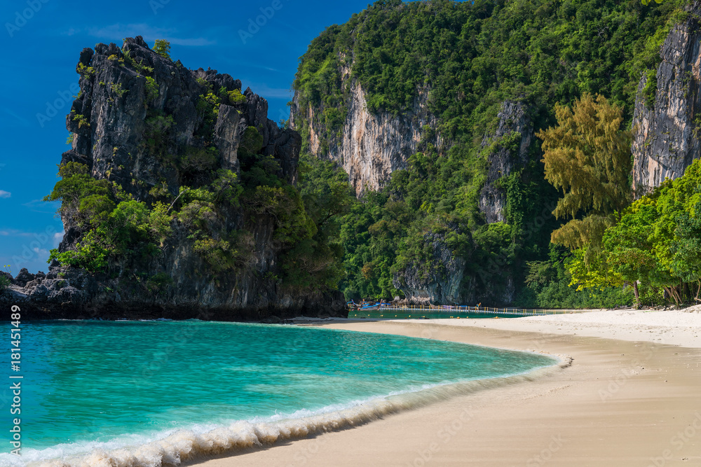 urquoise water and sandy beach, high cliffs in a beautiful place in Thailand - Hong Island
