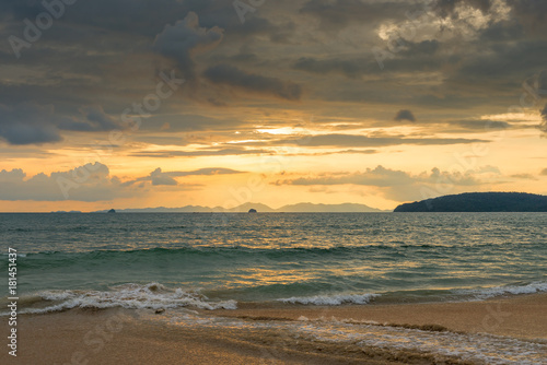 orange sunset in Thailand in golden tones, beautiful clouds over the sea