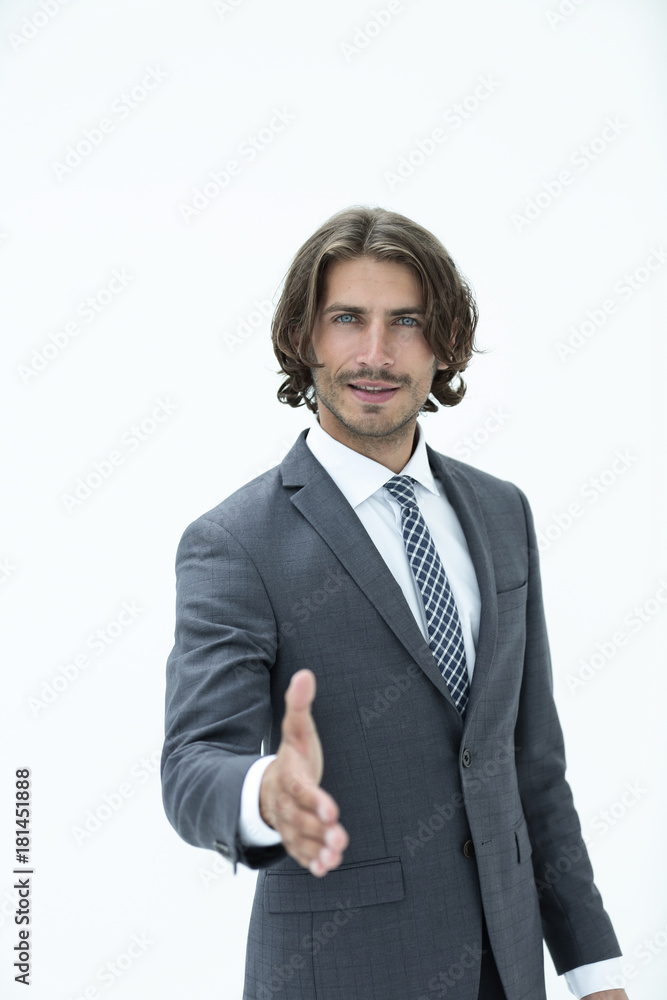 Smiling friendly businessman offers a handshake Smiling friendly businessman offers a handshake