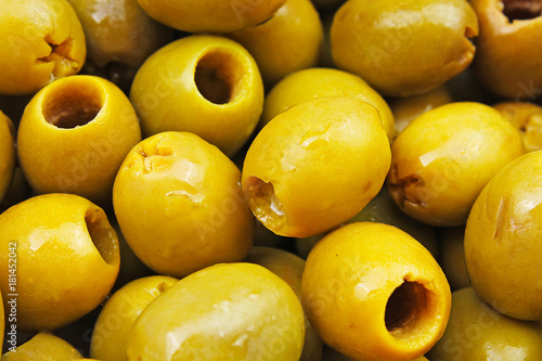 Olive texture. Olives as background. Shiny green olives. Olive wallpaper patt...