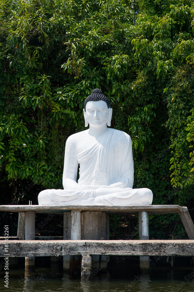 buddha statue on river bank buddha statue on river bank