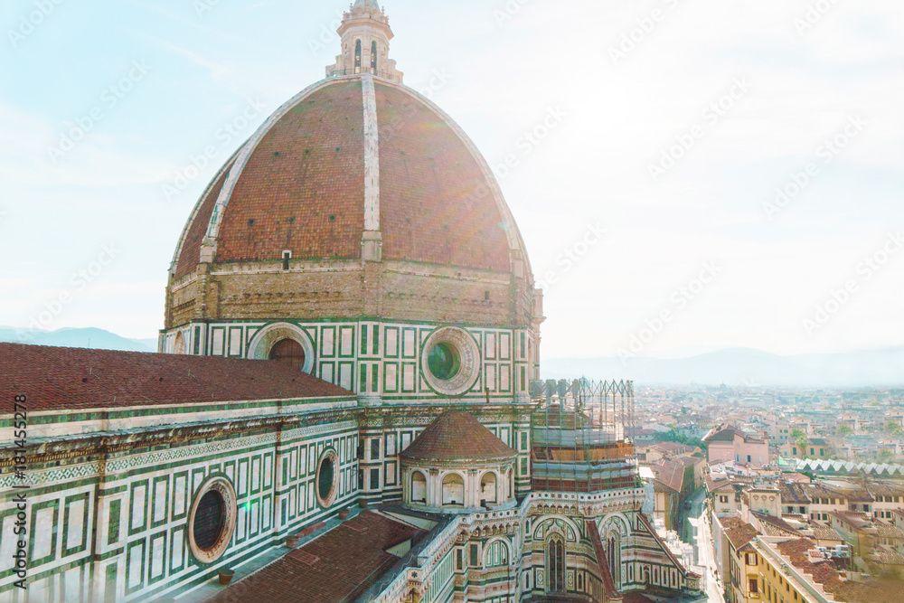 Florence city aerial view with duomo dome and cityscape on horizon