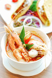 Spicy soup with shrimp in bowl