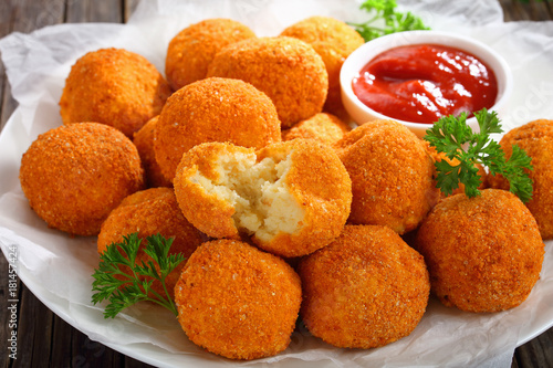 delicious potato croquettes with ketchup, close-up