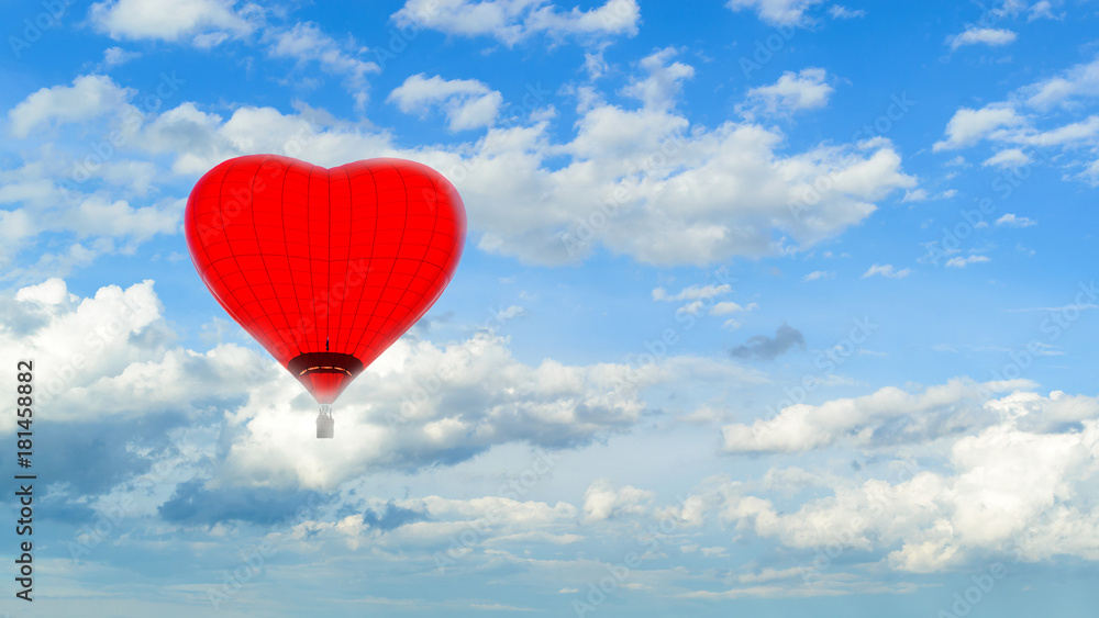 Hot air red ballon in the shape of heart against blue sky with white fluffy clouds and copyspace for text