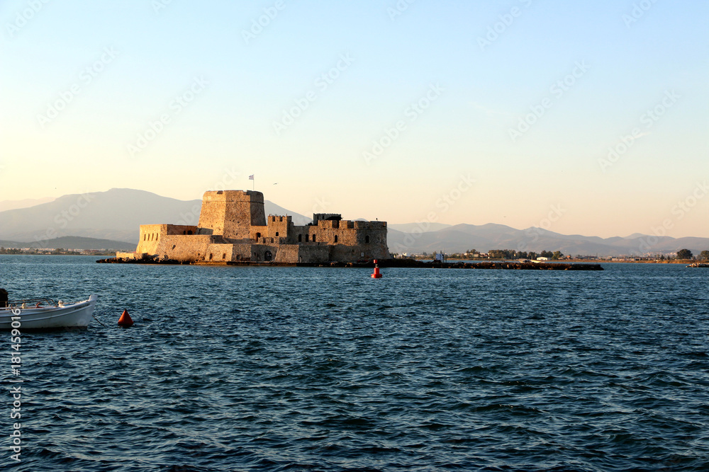 The Bourtzi water castle is a small island with a fortress at the coast of Nafplio in Greece