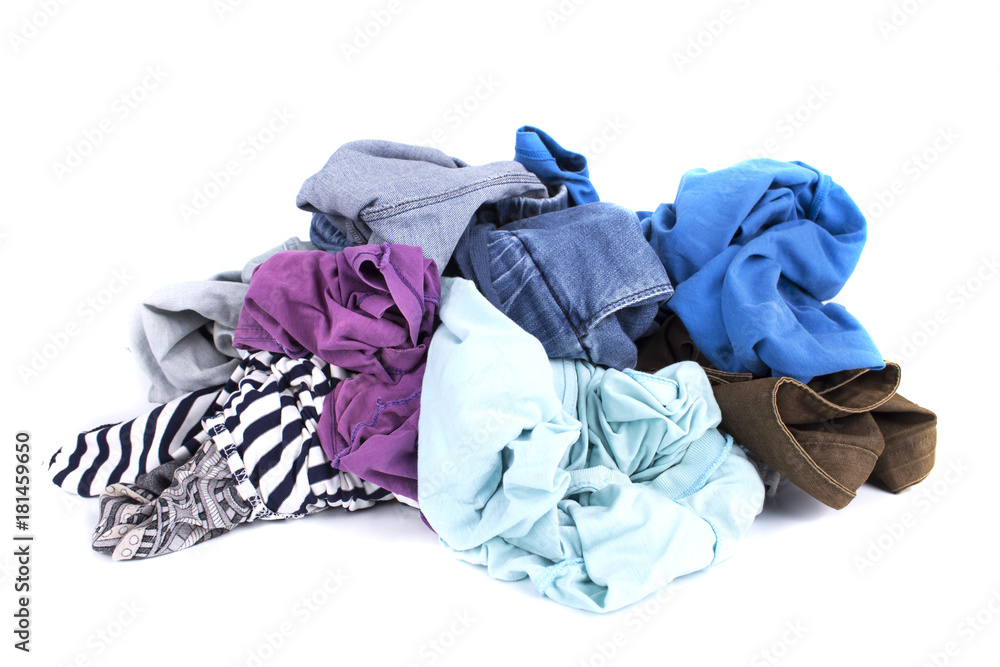 Big heap of colorful clothes isolated on white background Big heap of colorful clothes isolated on white background