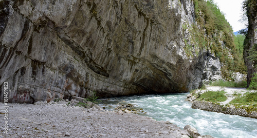 mountain river flowing into the rock