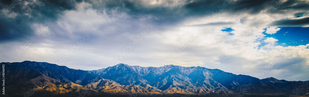 Beautiful Blue rocky canyon mountain landscape with cloudy sky in panorama view