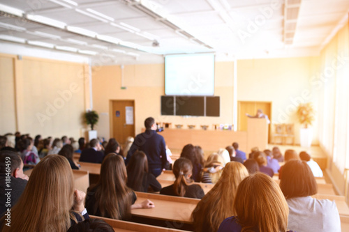 Принти на полотні Rear view of students sitting and listening in lecture hall, selective focus