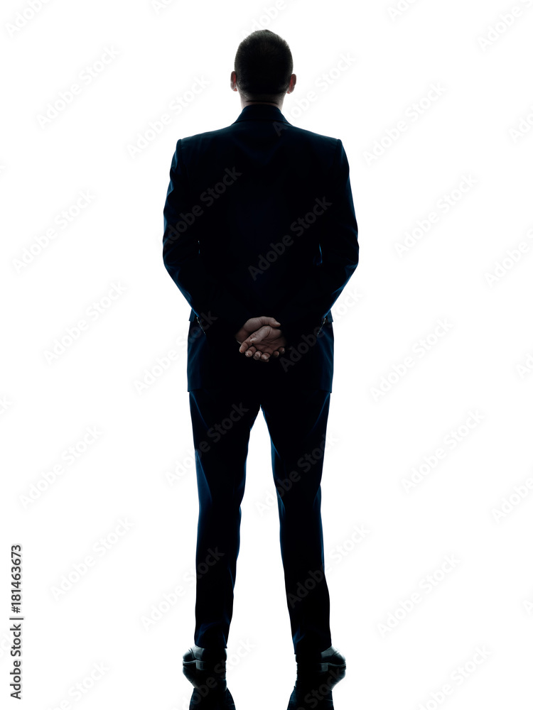one caucasian business man standing rear view silhouette isolated on ...