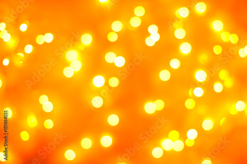 Christmas background. Festive gold abstract background with bokeh defocused lights