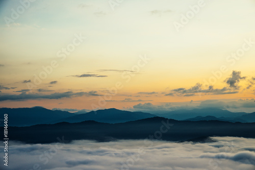 Beautiful Sea of mist in the morning with layer of mountain and sunrise © gjeerawut