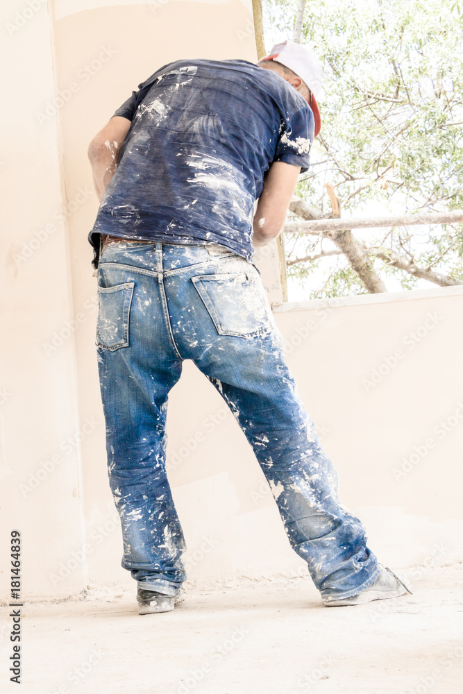 Construction worker with jeans and street shoes Construction worker with jeans and street shoes